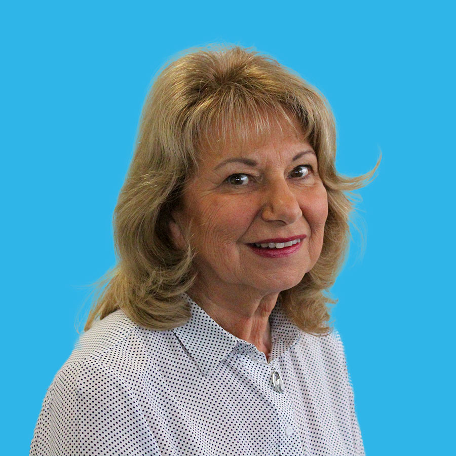 edi-rogers-portrait a portrait of Edi Rogers on a blue background