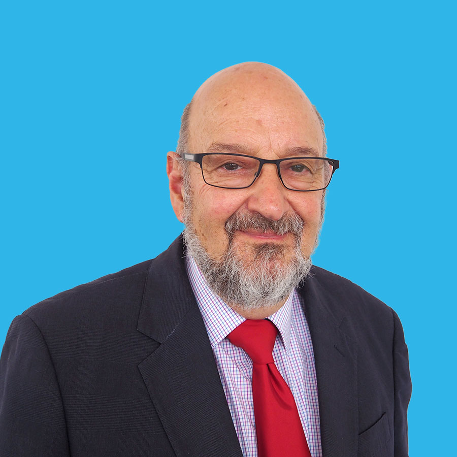 les-sheffield-portrait a portrait of Les Sheffield on a blue background