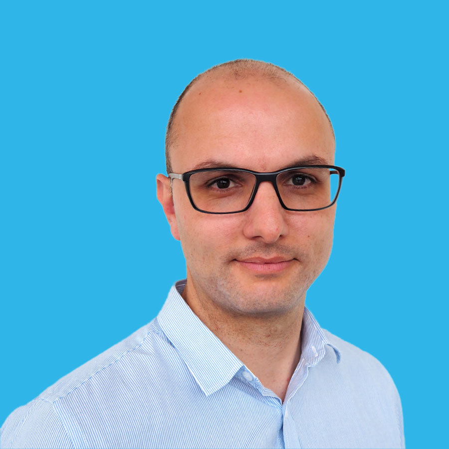 sam-mostafa-portrait a portrait of Sam Mostafa on a blue background