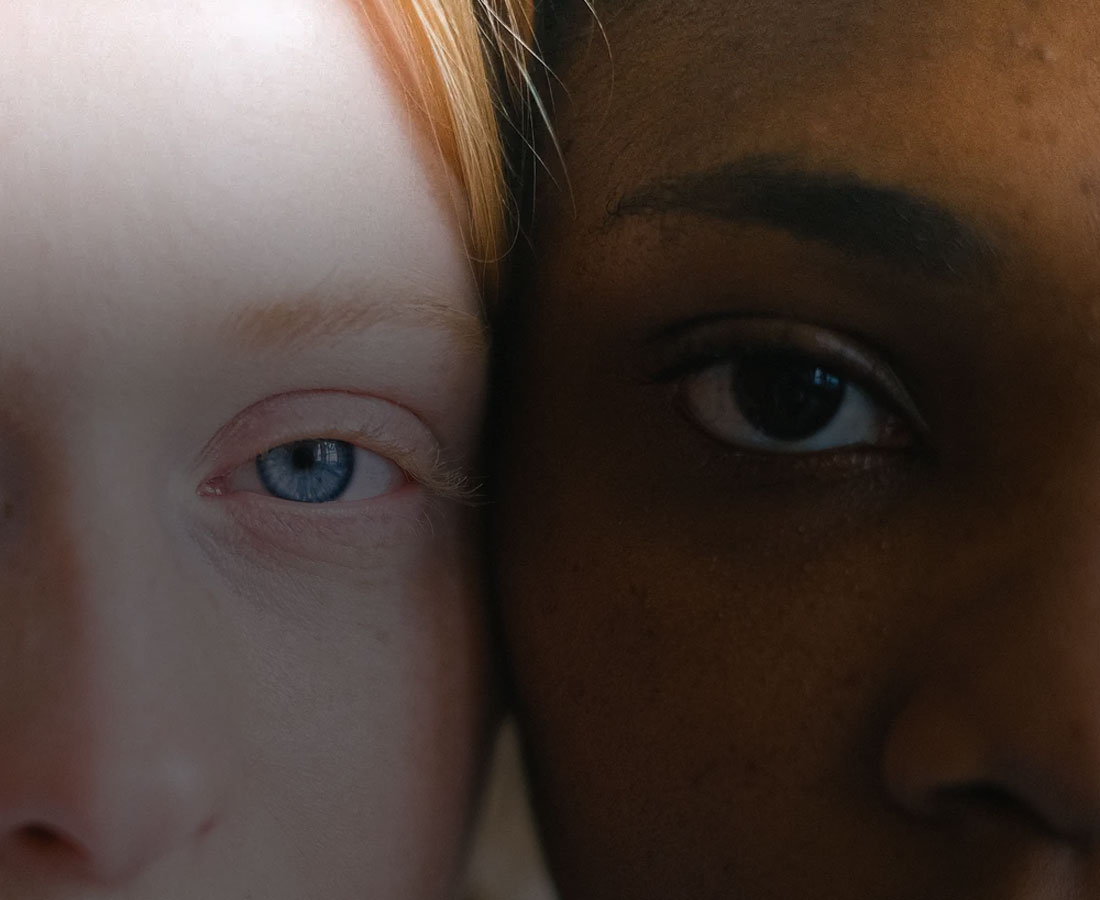 close-up-two-people-eyes a close up photo of two different people's eyes and face