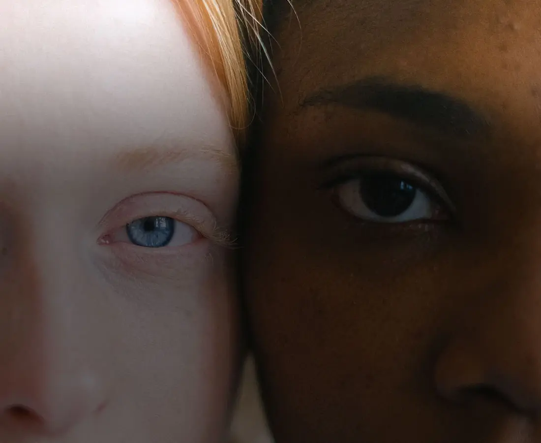 close-up-two-people-eyes a close up photo of two different people's eyes and face