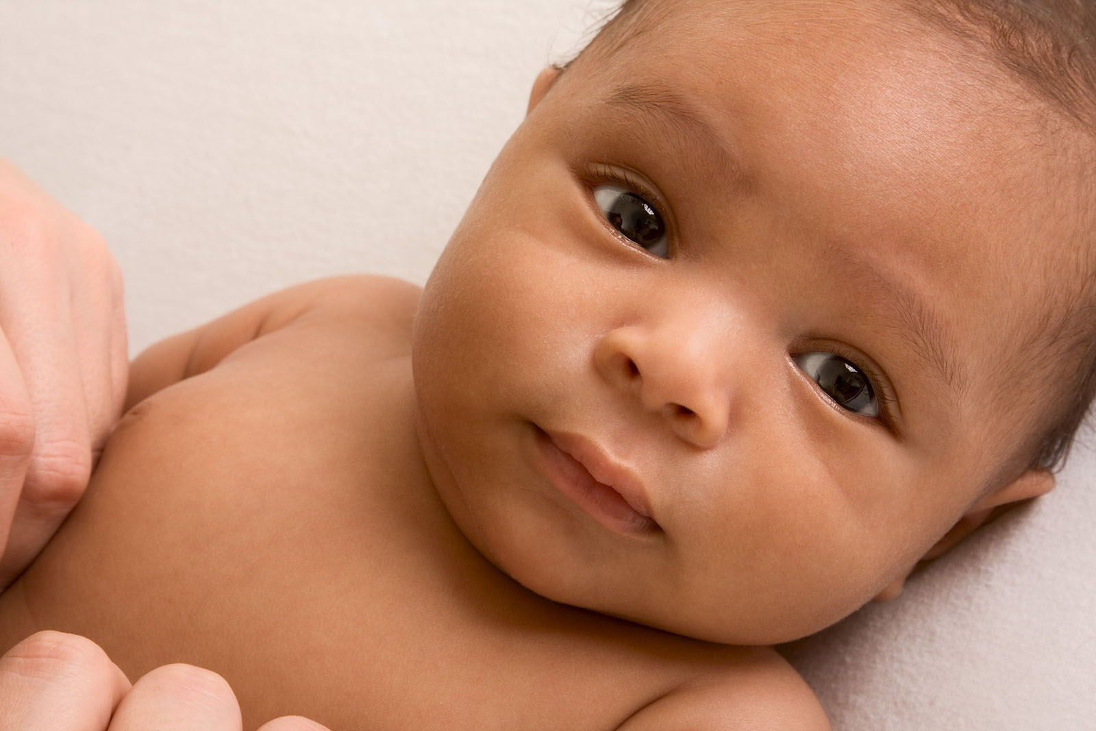 a close up photo of a baby with large eyes