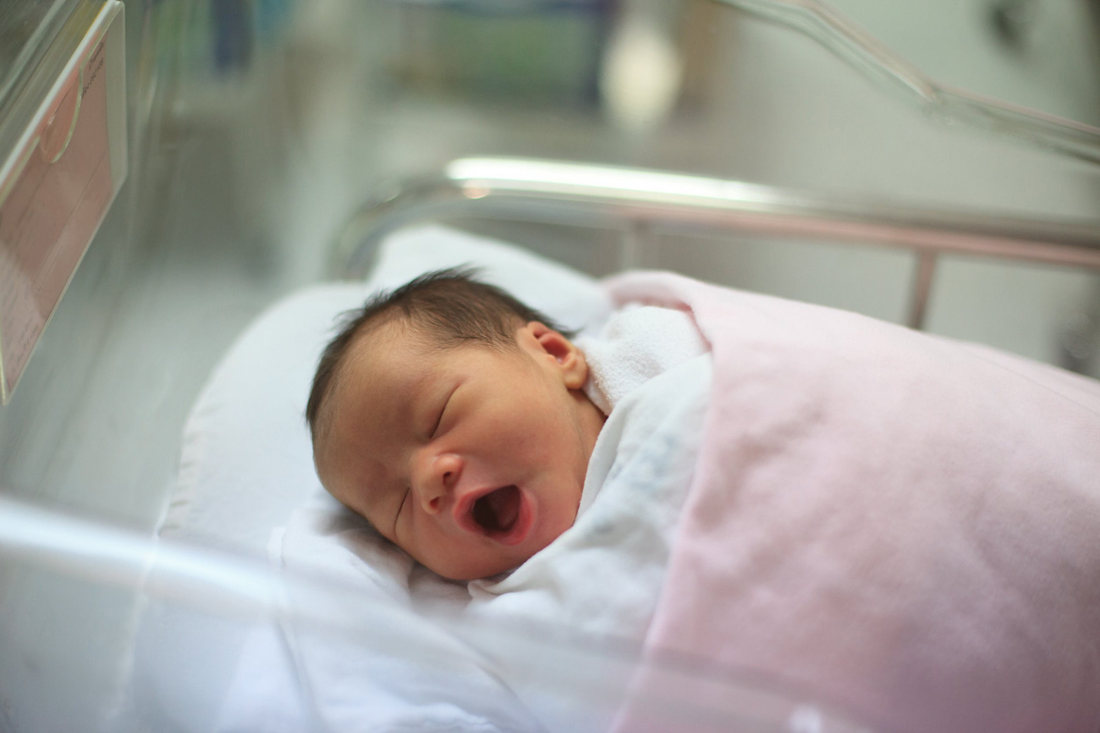 a newborn baby in a nursery