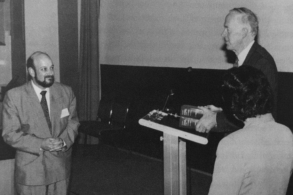 Black and White photo of myDNA Founder Les Sheffield Recieving an award