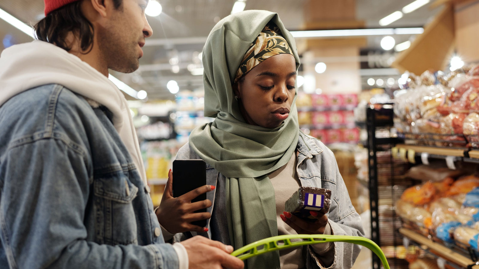 A muslim couple buying groceries at a market