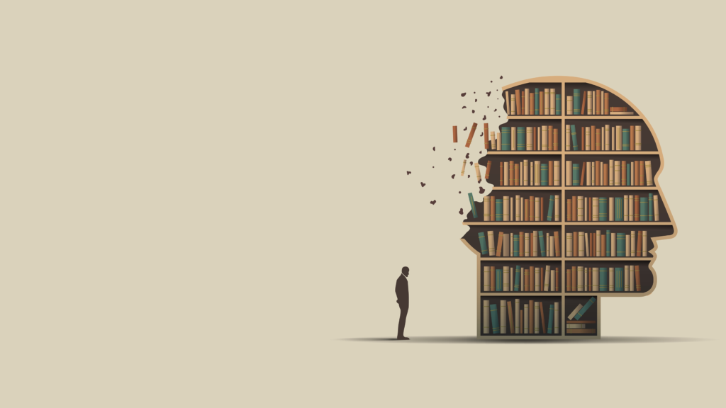 A Man standing next to a head shaped bookshelf