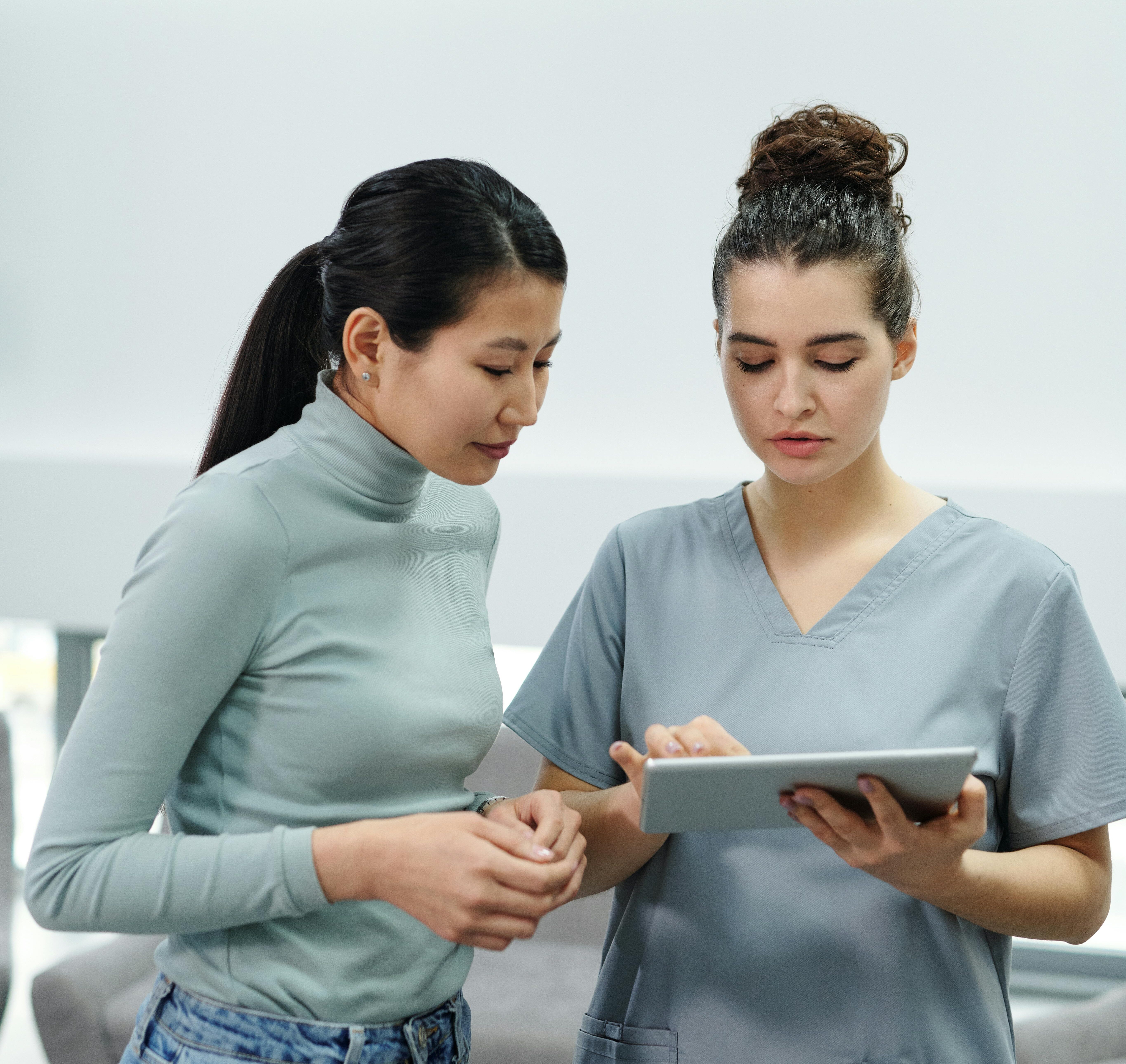 pexels-cedric-fauntleroy-4266947 Nurse and patient looking at results